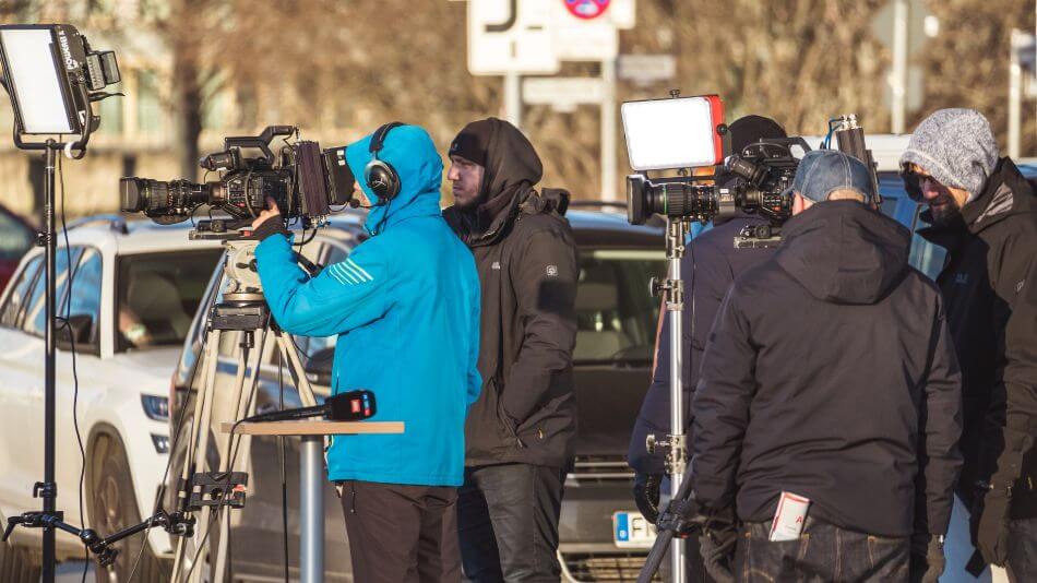Men filming a movie on set with a camera
