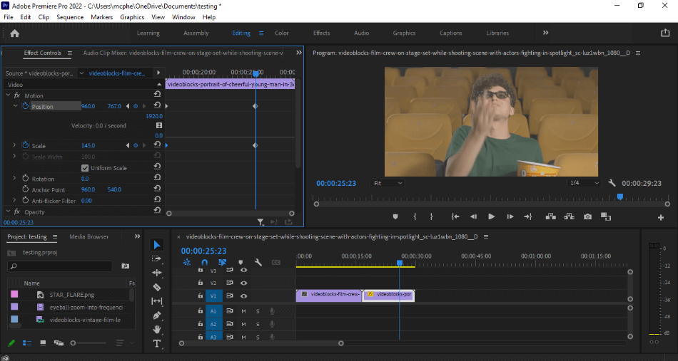 Premiere Pro editing effects of footage of a man eating popcorn in a theater
