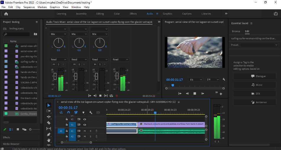 Premiere Pro Audio Workspace editing audio over footage of hand touching sand