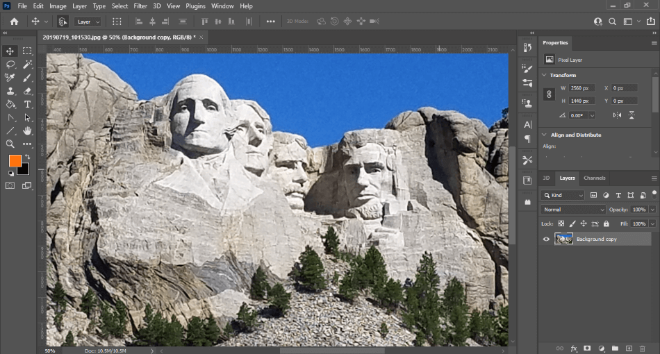 Photoshop interface with Mount Rushmore