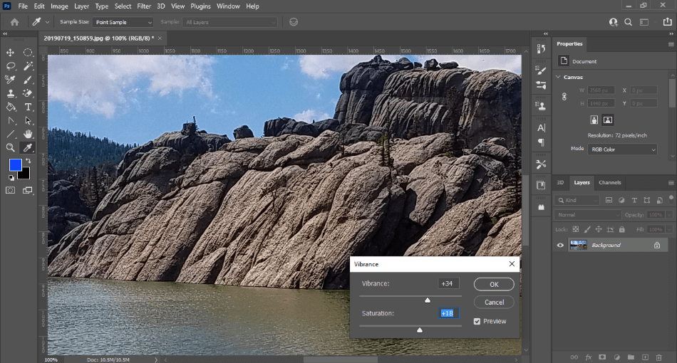 Photoshop editing vibrance of mountains on lake