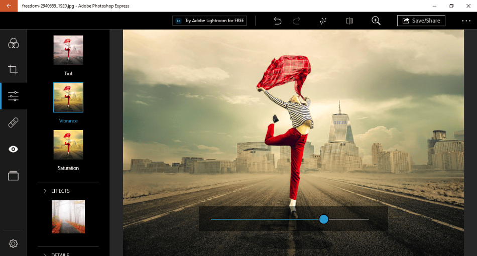 Photoshop Express changing vibrance on photo of a woman with red cloth in city