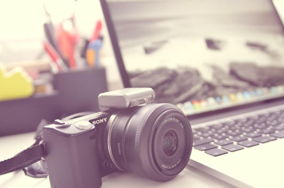 camera next to a laptop