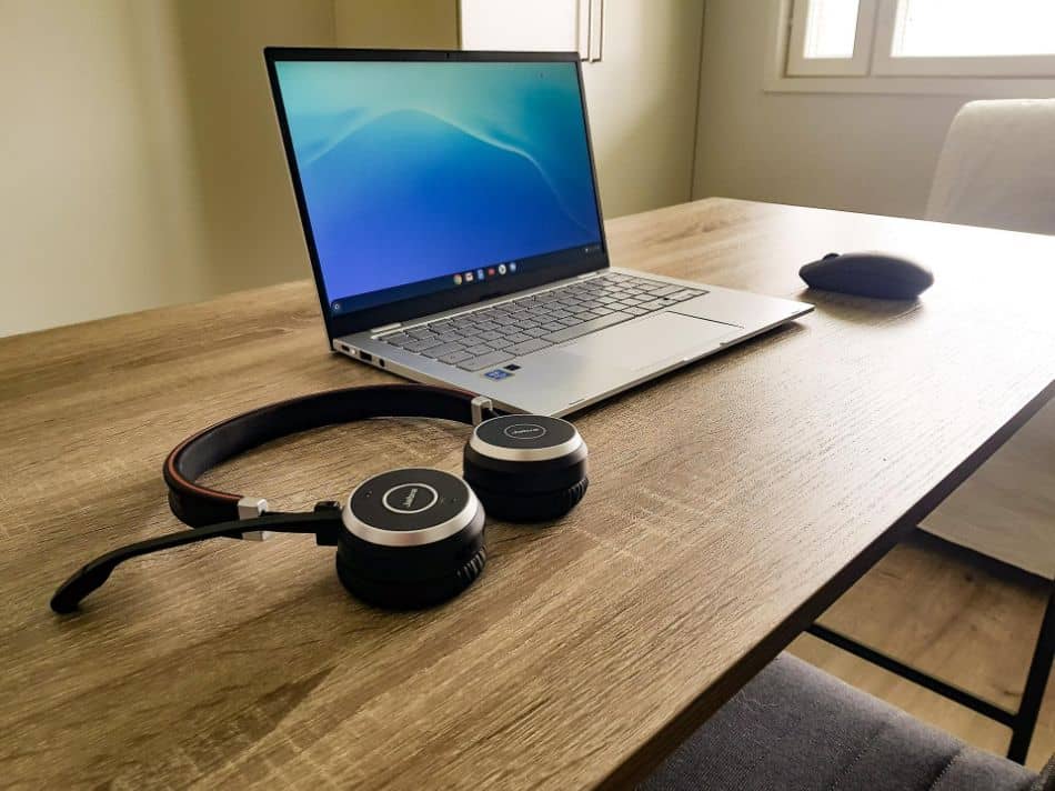 laptop on desk with headphones 