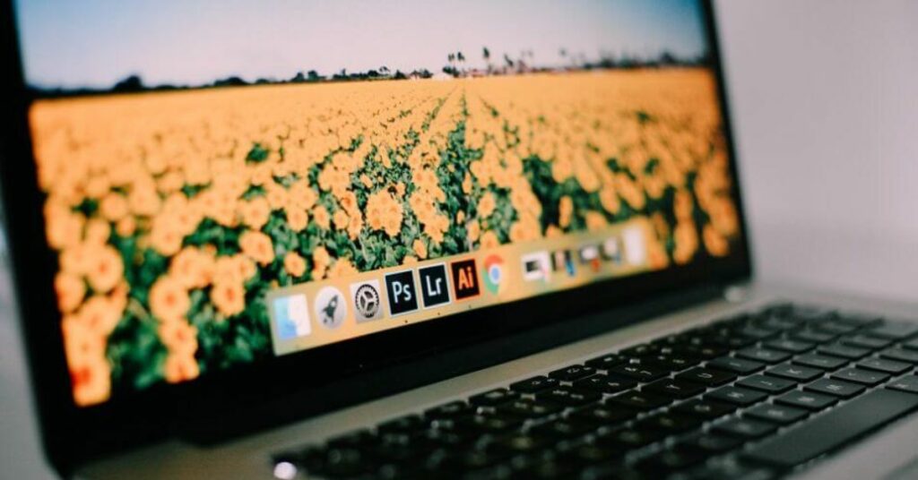 laptop with icon for Lightroom on toolbar