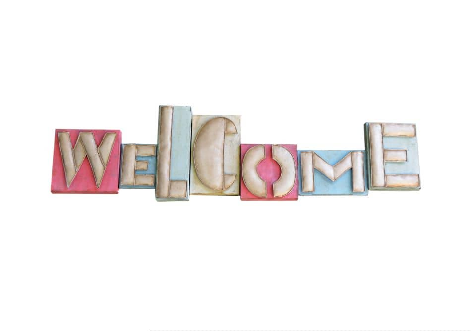 wooden text spelling welcome 